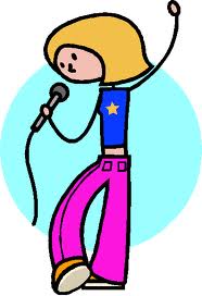 A picture of a girl singing into a microphone