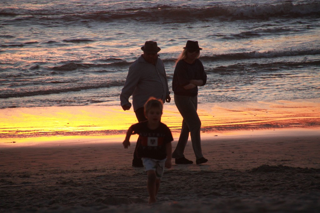 photo of a family at sunset.